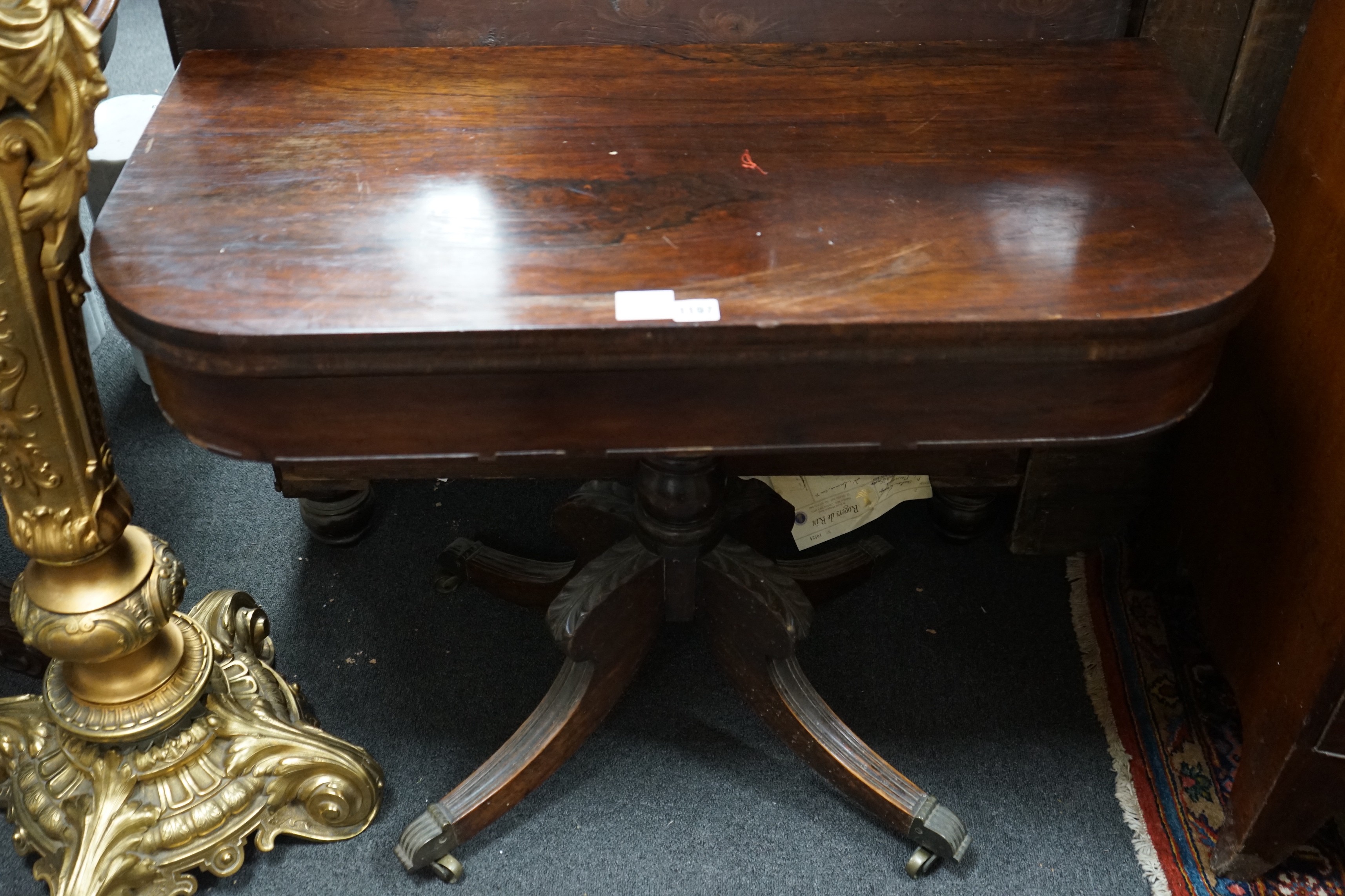A Regency rosewood D shaped folding tea table, width 91cm, depth 45cm, height 72cm